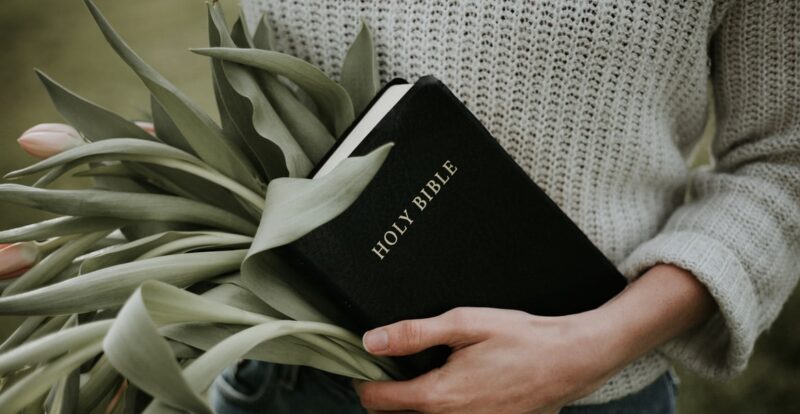 holding a bible